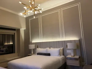 bed and chandelier in a room at Intercontinental Indianapolis Hotel