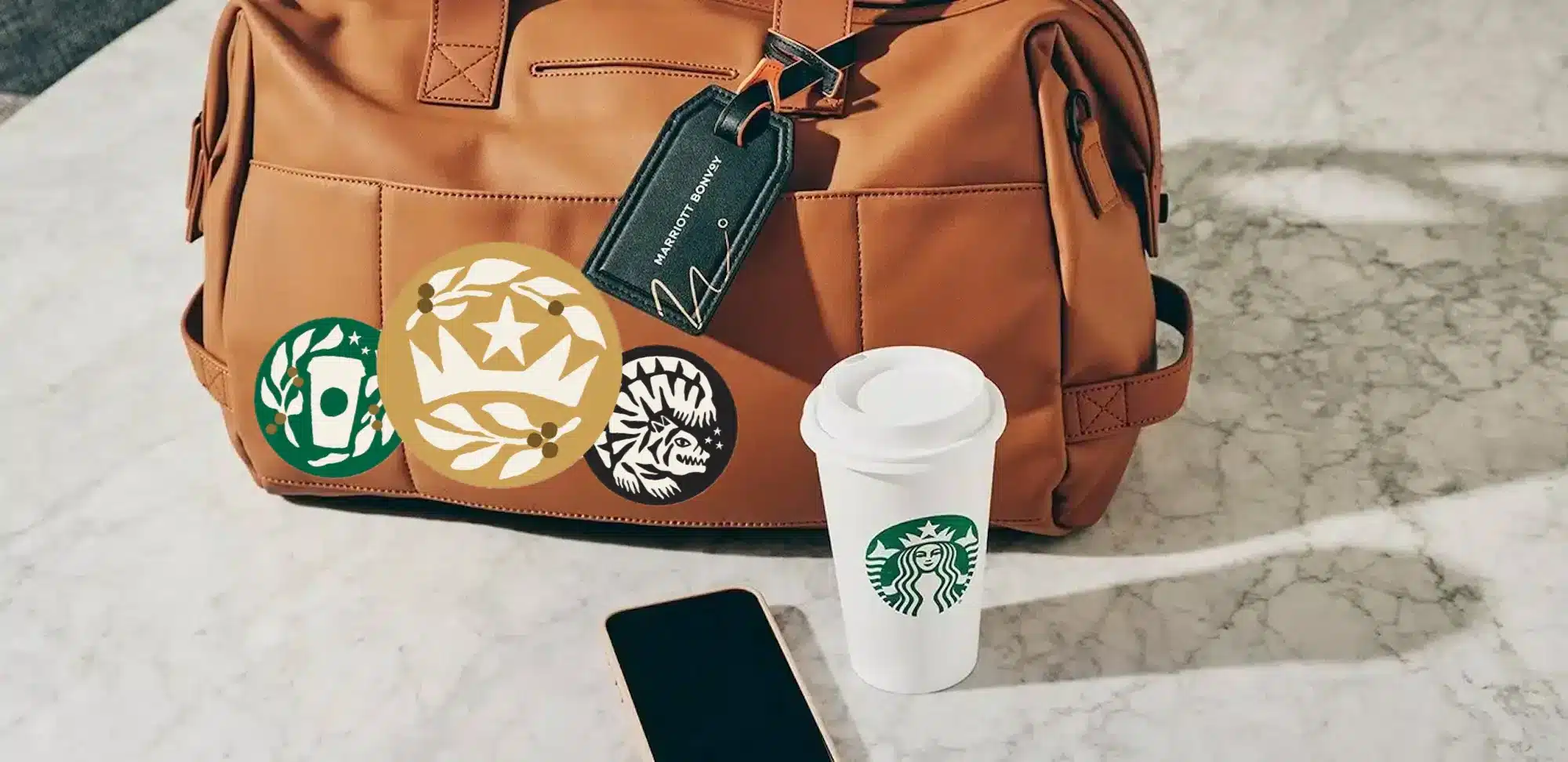 dufflle bag with Starbucks logos and a grande coffee