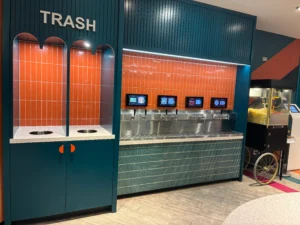 Trash and beverage fountains at The Club ATL's grab-and-go
