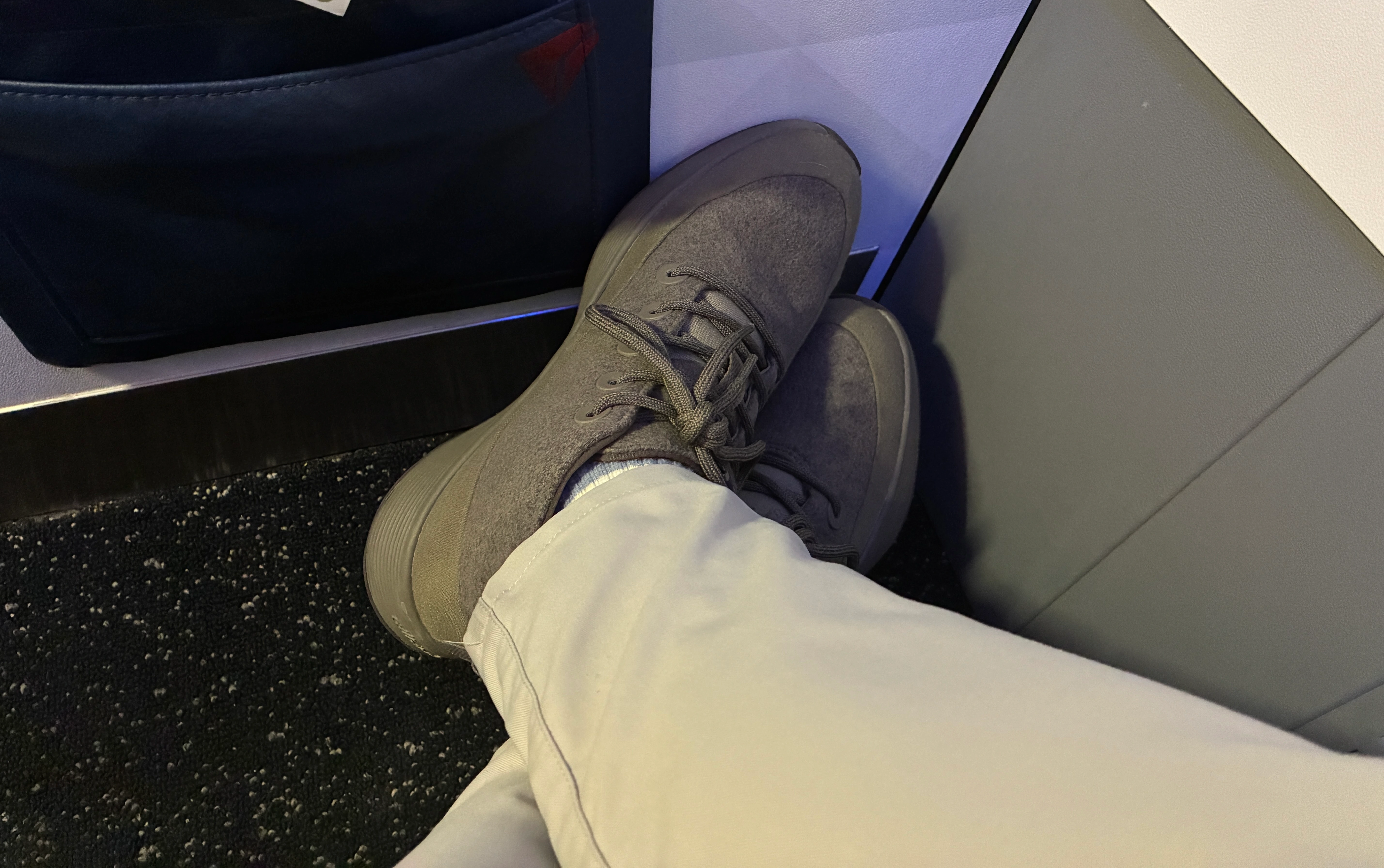 wearing a Allbirds Weatherproof Hightops on a plane