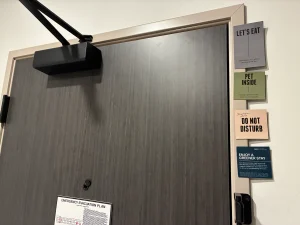 hotel room door at Atwell Suites Kansas City Airport with Do Not Distrub magnet note