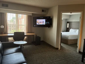 view of living area and bedroom at suite in the Residence Inn Indianapolis Downtown on the Canal